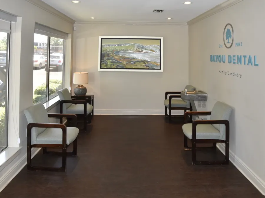 The waiting room wall at Bayou Dental: the tree logo, Est. 1983, Family Dentistry.